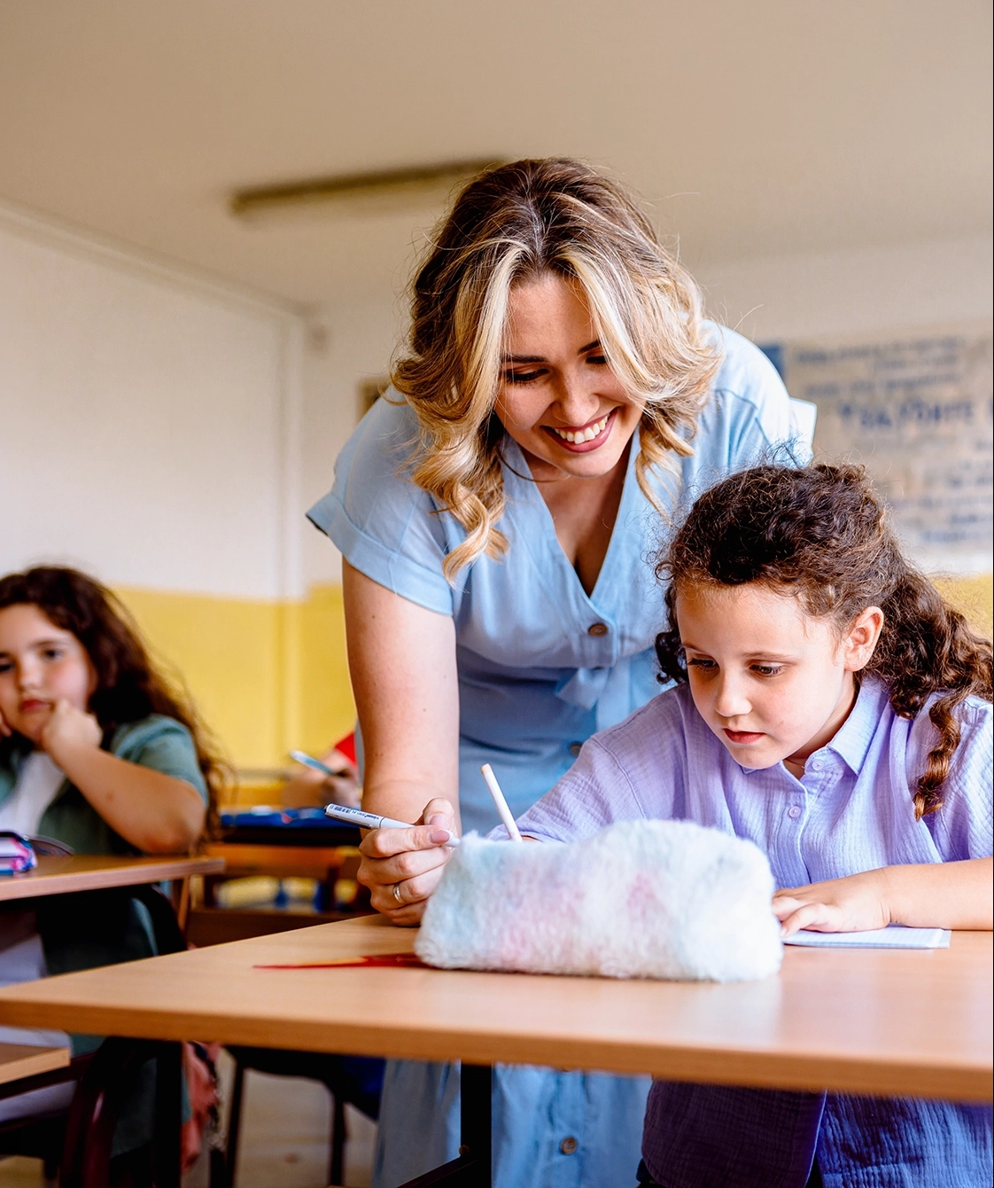 A teacher guiding a student through a learning activity